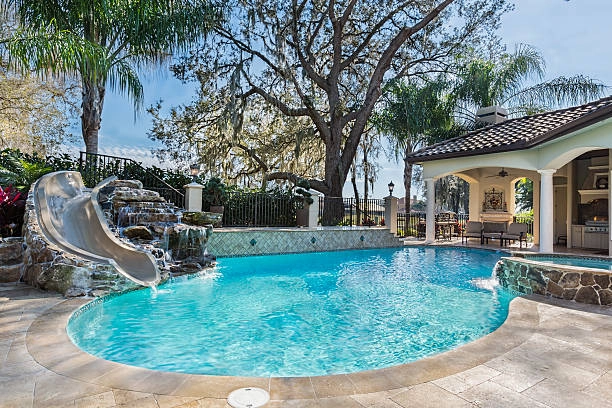 outdoor pool with slide and house -pool remodel