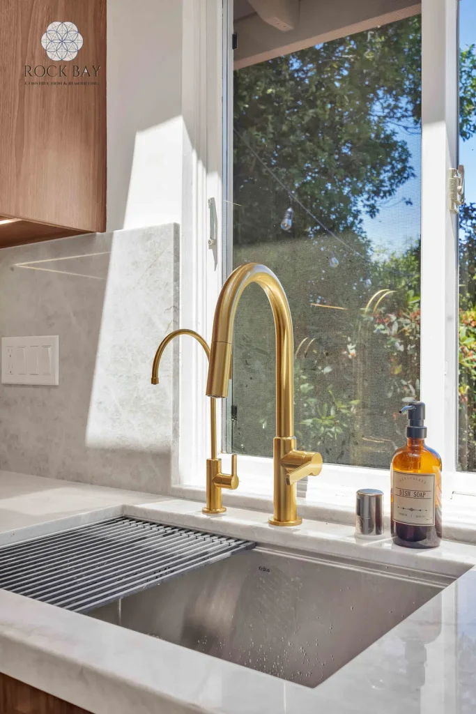 Kitchen remodel brass faucet sink detail
