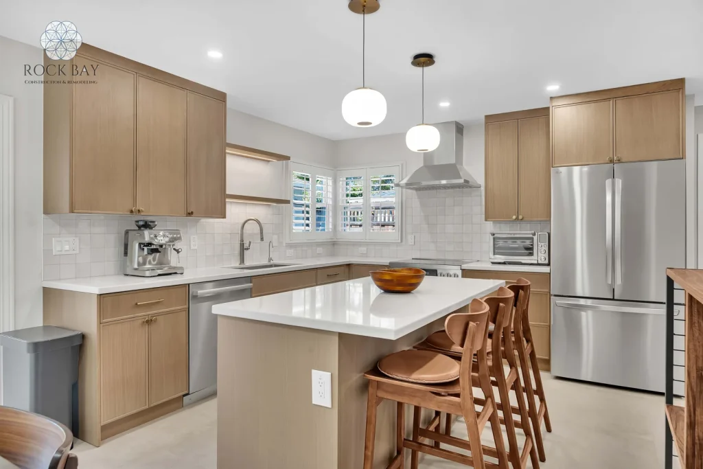 Full kitchen remodel island seating stainless fridge