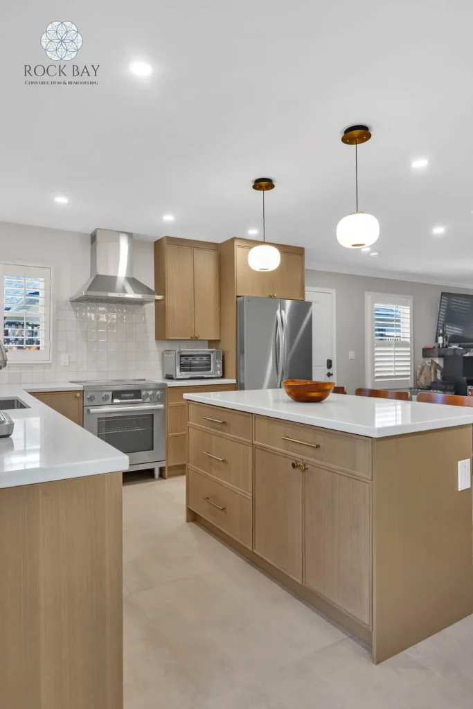 Full kitchen remodel waterfall island pendant lighting